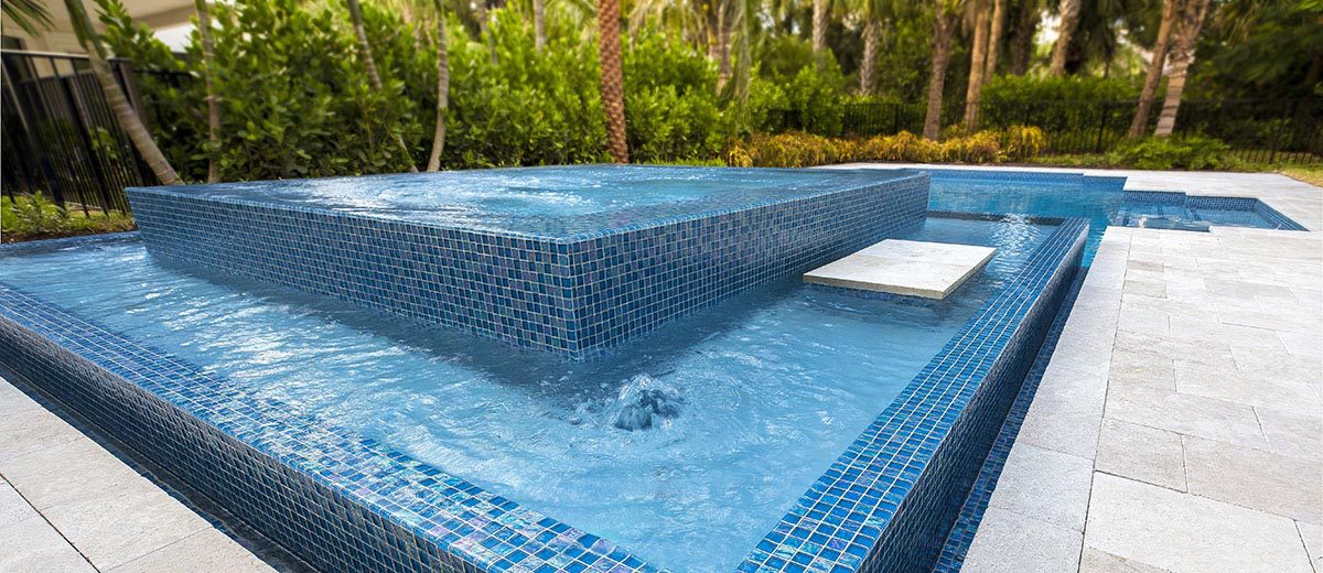 Glass Tile vs. Porcelain Tile: Choosing Your Pool Mosaics